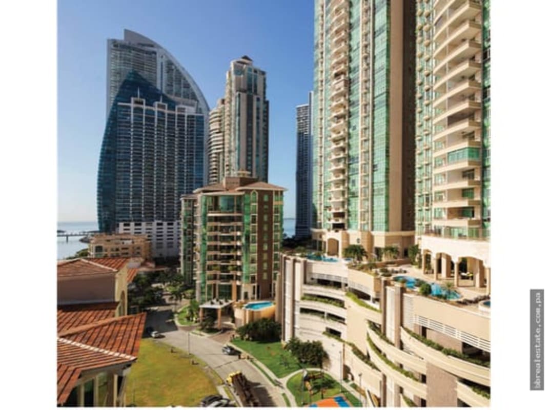 High-end designer kitchen in Pacific Point Tower 400 featuring granite countertops and ocean views