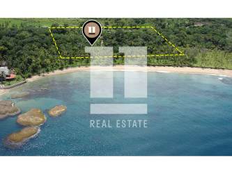Aerial image highlighting sandy beach and turquoise water of Palenque coastal property for sale