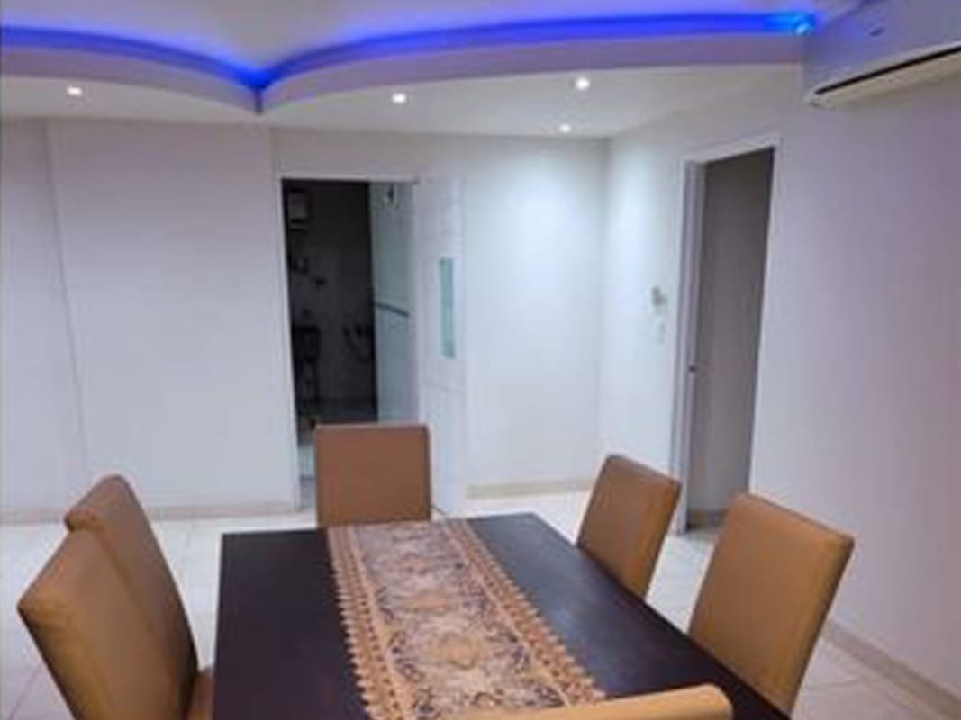 Balcony terrace with city skyline at night in PH Oceania Panama City