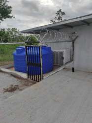 Utility zone with water storage fenced area and HVAC Barrio Balboa La Chorrera Panama