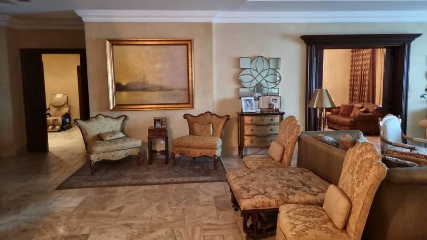 Spacious formal living area with artwork, ornate furniture at PH Bellagio Panama City
