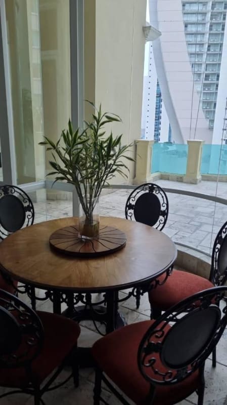Dining area with glass walls near balcony terrace in PH Bellagio Tower Panama