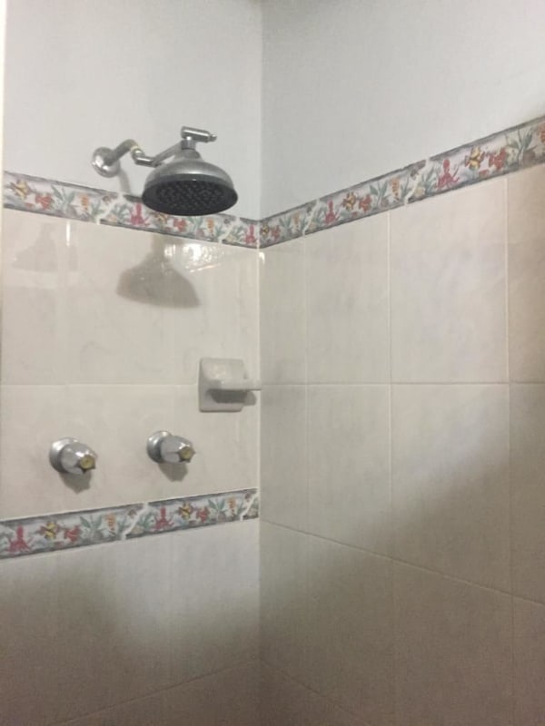Shower area with decorative tiles and white ceramic, PH Albrook Gardens Clayton Panama