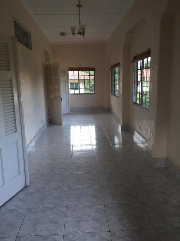 Spacious hallway with ceramic tiles and multiple garden-view windows PH Albrook Gardens