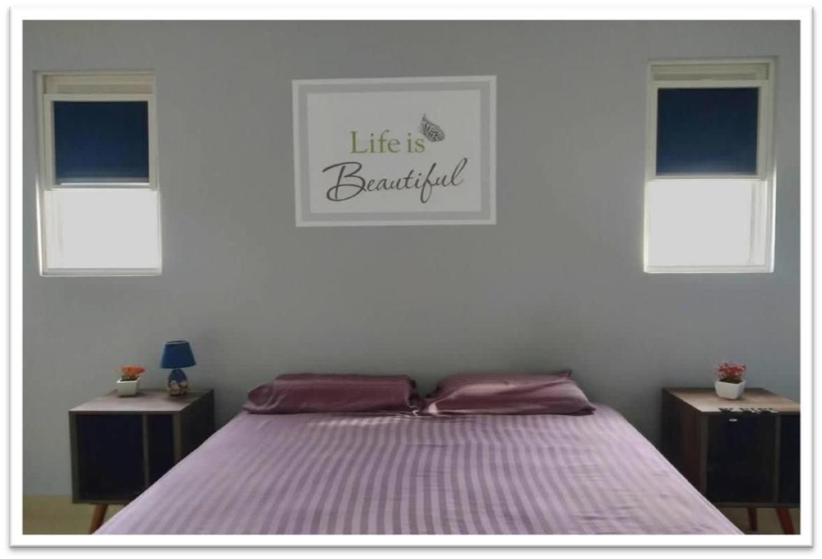 Empty bedroom with large window and white walls in modern townhouse PH Augusta Brisas del Golf