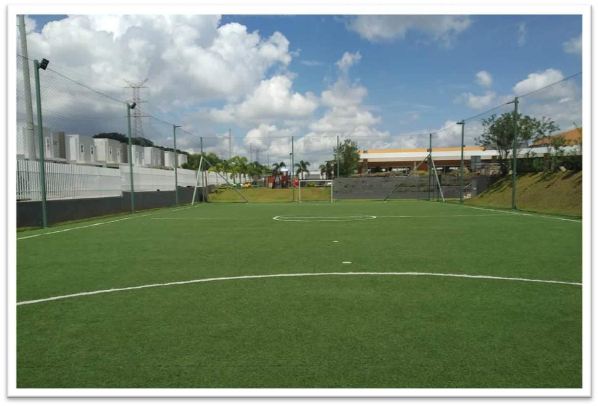 Artificial turf soccer field with goalposts fenced in PH Augusta Brisas del Golf Panama