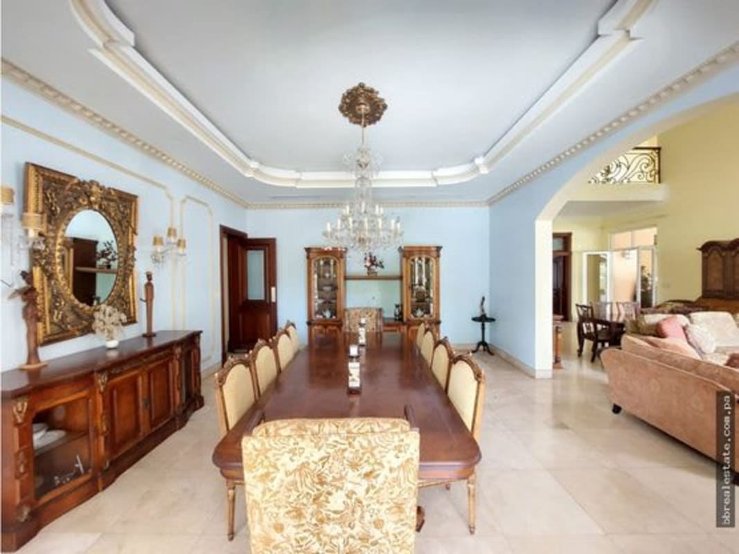 Luxury formal dining room with chandelier at villa for sale Costa del Este Panama