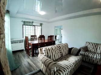 Open plan living and dining with bright windows, mountain garden views Alto Boquete Panama