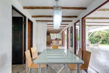 Dining space with sliding doors to garden and exposed beams Costa Esmeralda