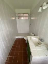 Living room opening to terrace with sliding doors and ocean views at Playa Corona beach house