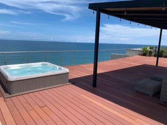 Resort-style infinity swimming pool with ocean backdrop at Punta Caelo Panama