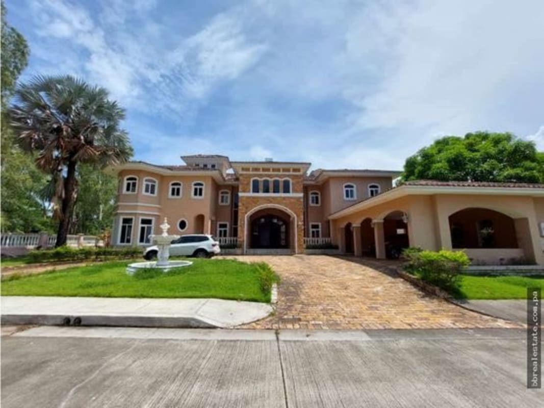Spacious living room with marble floors and large windows in Villa del Mar Costa del Este