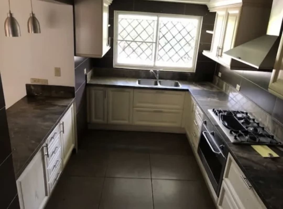 Bedroom with tile floors, built-in dark wood closet, fan, in Los Angeles El Dorado Panama