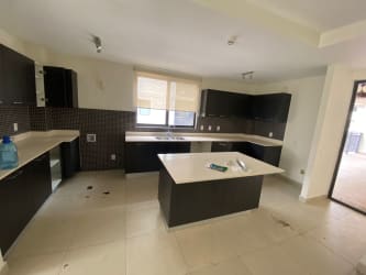 Spacious kitchen with center island cabinetry appliances River Valley Panama Pacifico