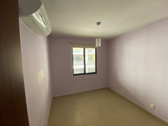 Bedroom with neutral tiles window built-in closet River Valley Panama Pacifico