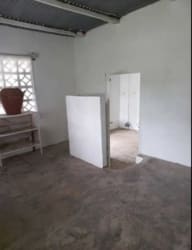 Simple bathroom with shower pedestal sink breeze blocks La Chorrera Panama house for sale