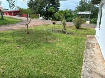 Fenced garden green lawn affordable home in Barrio Balboa La Chorrera Panama for sale