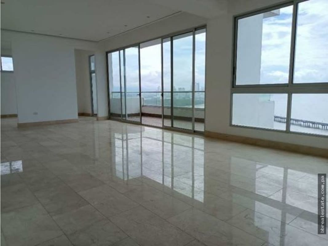 Luxury kitchen with marble countertops, center island, and built-in appliances at PH Panorama Coco del Mar Panama