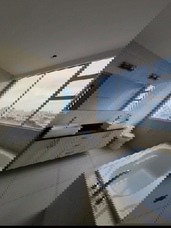 Empty modern living room with large windows, recessed lighting, skyline panorama PH Highland View Panama