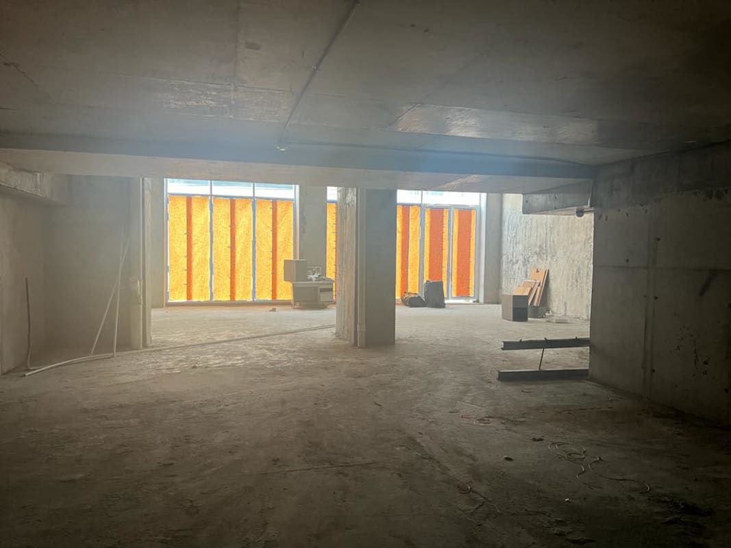 Unfinished concrete retail showroom space with mezzanine PH 43 Green View Bella Vista