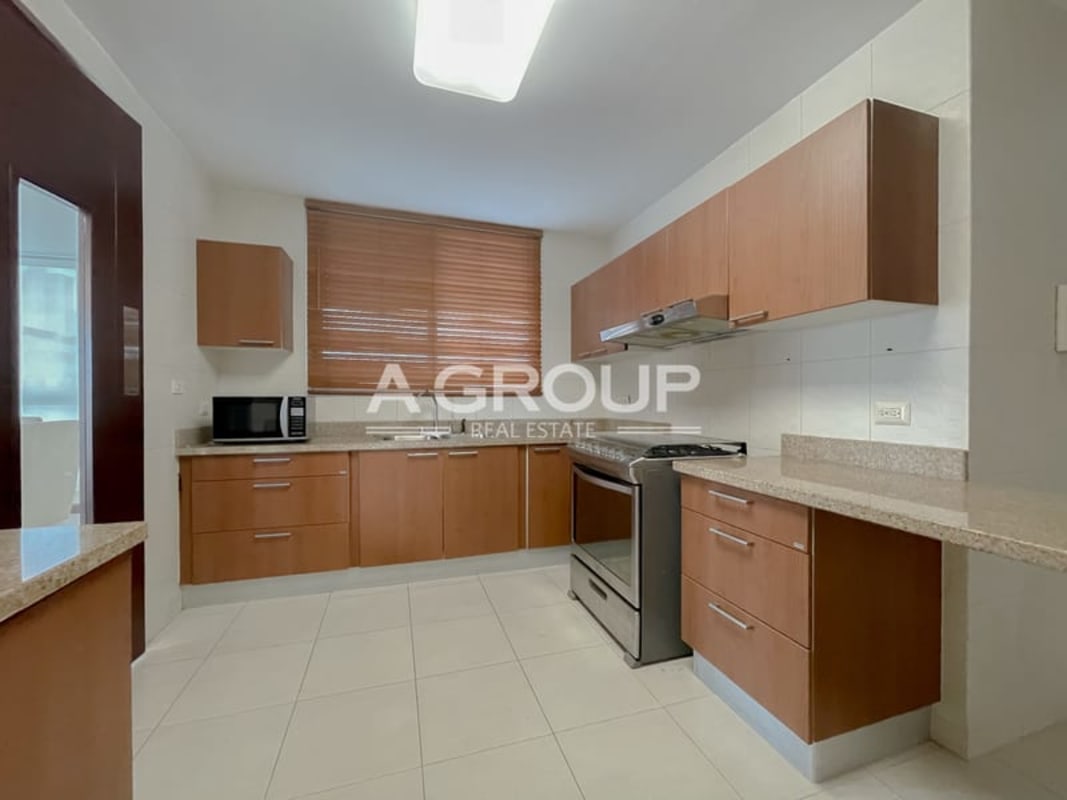 Fitted kitchen with wood cabinetry granite tops PH Soho Tower Costa del Este Panama
