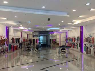 Retail clothing showroom with mannequins and tiled floors in Free Zone Panama