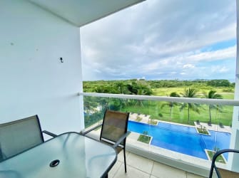 Balcony overlooking pool lagoon and ocean at PH Ocean Two Playa Blanca apartment