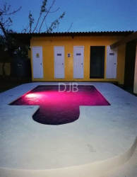 Brick barbecue with propane tanks and LED-lit bar in covered patio Gorgona multi cabin property