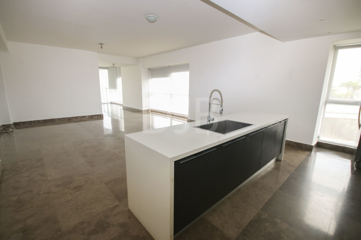 Luxury apartment open-plan kitchen with marble floors, large windows at BICSA Financial Center Panama