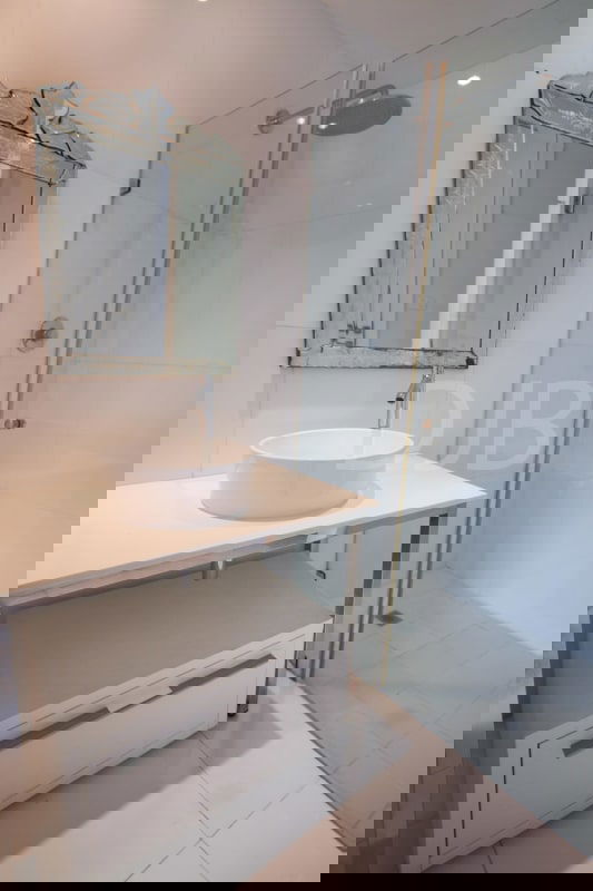 Open living area with floor-to-ceiling windows and marble floors at PH BICSA Tower