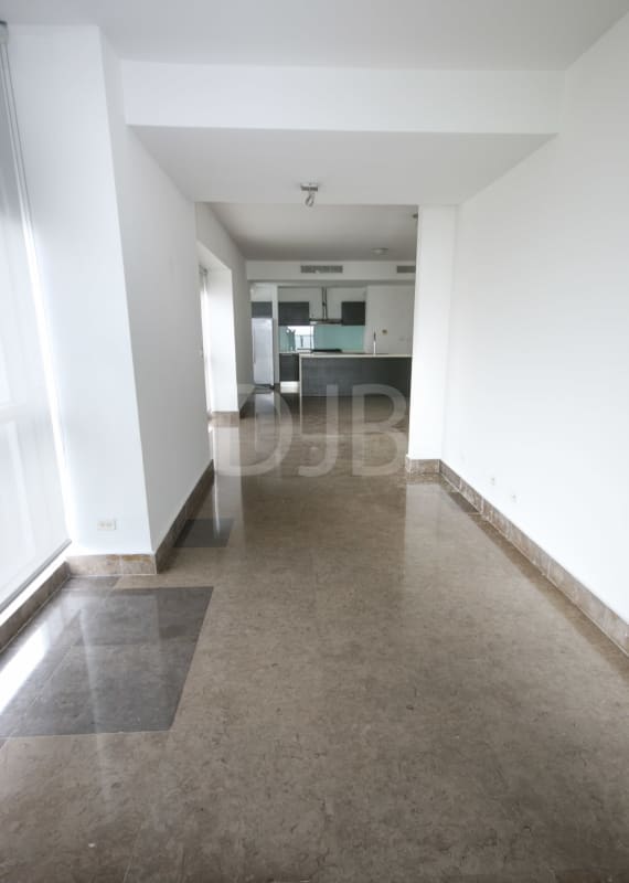 Modern open-plan living dining with kitchen overlooking ocean views at BICSA Tower