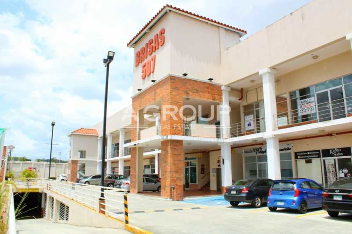 Two-story shopping center exterior with parking plaza Brisas 507 Panama