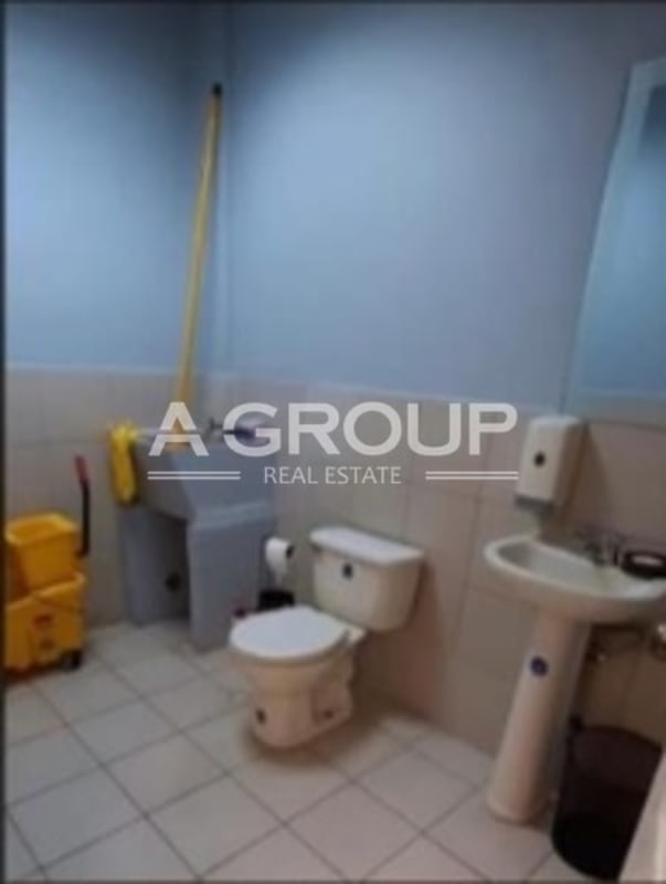 Functional restroom with pedestal sink and tiled floor in commercial space Plaza Brisas 507 Panama City