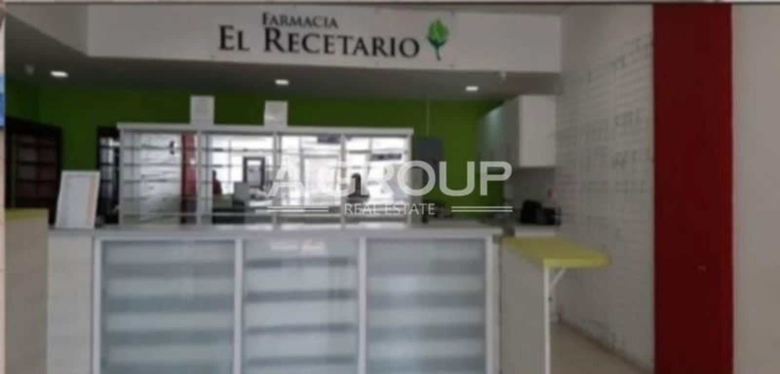 View of shopping plaza Brisas 507 entrance with storefronts and parking Panama City Brisas del Golf