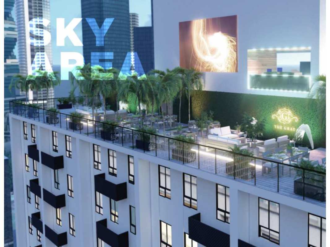 Bright bedroom with window and city view at The Gray Calle 50 Panama City