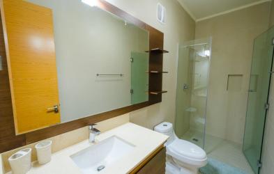 Private balcony with BBQ, seating and panoramic ocean views at Casamar San Carlos