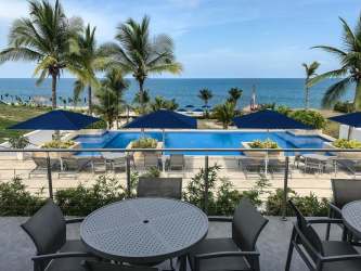 Spacious bedroom with king bed, ceiling fan, balcony access with sea views Casamar