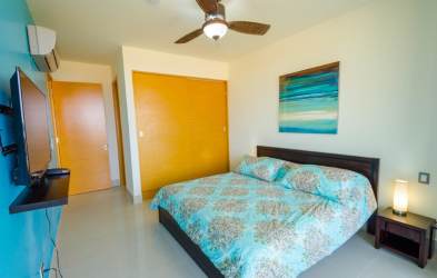 Modern white kitchen with stainless appliances and breakfast bar Casamar San Carlos Panama