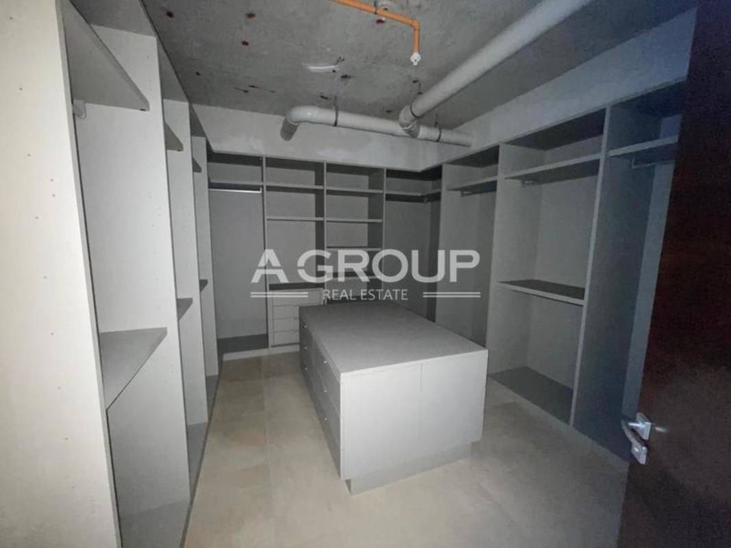 Modern kitchen with island, panoramic window views in PH Azalea Santa Maria