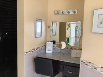 Covered patio with ceiling fans hammock outdoor dining overlooking garden in Costa Arriba Portobelo