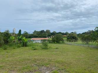 Buildable flat grassy land with fence for residential or commercial use near Coronado beach