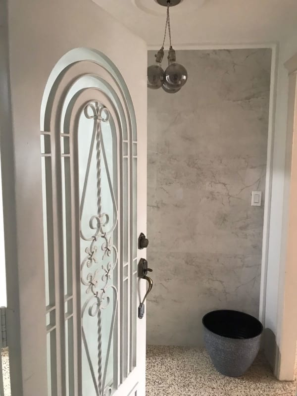 Entryway with wrought iron glass door, marble wall in PH Florida Obarrio Panama
