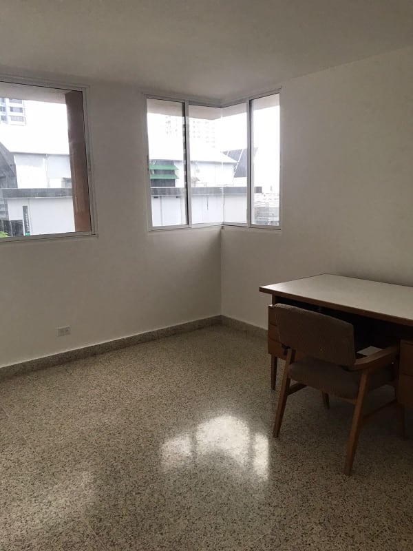 Minimalist study with large windows terrazzo floors at PH Florida Obarrio Panama