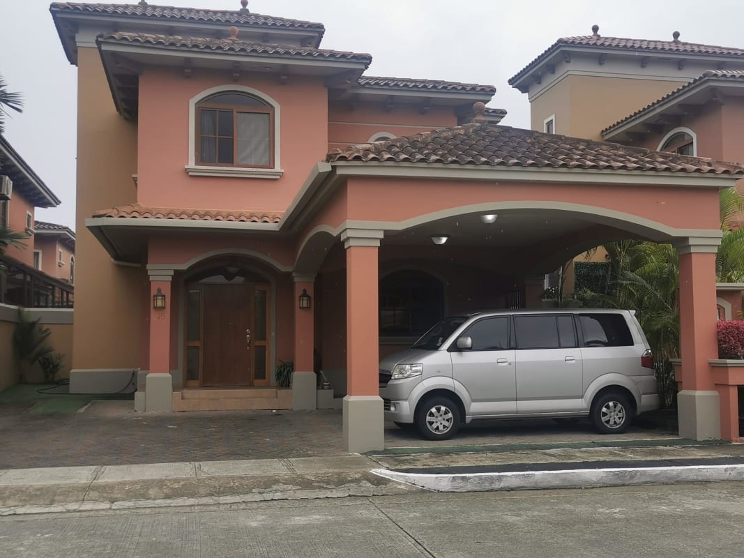 Granite countertop kitchen with wooden cabinets and dining nook in luxury house Ciudad Radial Panama