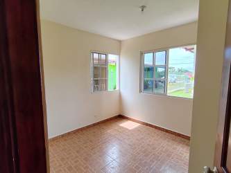 Simple kitchen in PH Machu Coronado with breakfast bar and ceramic tile floor