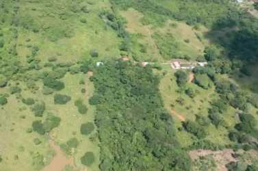 Panorama showing open fields and rural landscape with access road in La Chorrera Panama