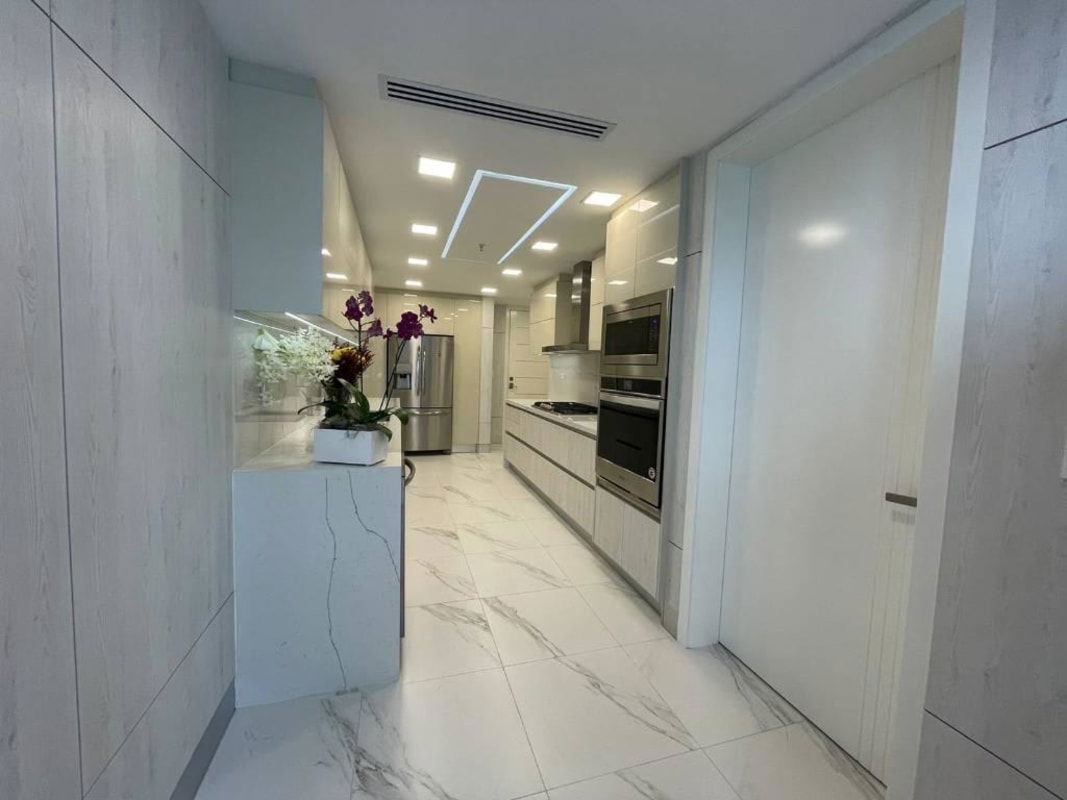 Elegant kitchen island, marble counter, modern appliances Q Tower Punta Pacifica