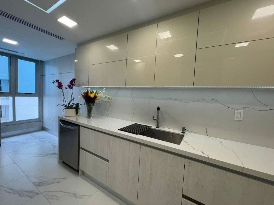 Luxury condo kitchen with marble countertops, stainless appliances, and ocean views in Q Tower Punta Pacifica
