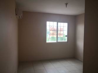 Empty bedroom with tile floors AC and large window Arboledas Los Olivos Panama Oeste