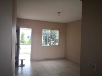 Minimalist living room empty with beige walls and window Costa Verde Panama